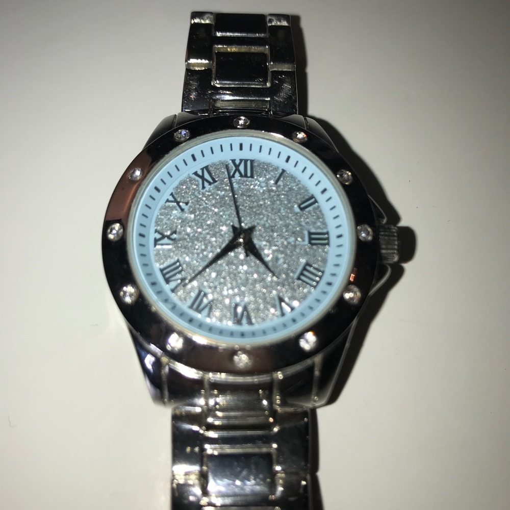 Sliver watch with blue sparkly face.